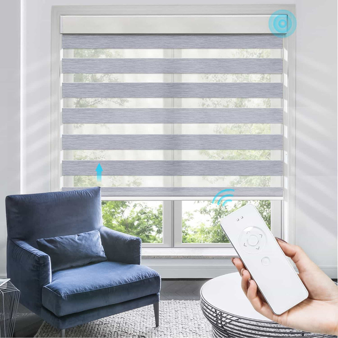 Smart shades controlled by a remote, partially open to allow natural light into a modern living room with a blue armchair, showcasing the convenience and style of automated window treatments in a smart home.